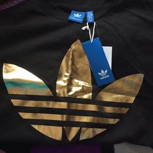 Black t shirt big gold trefoil